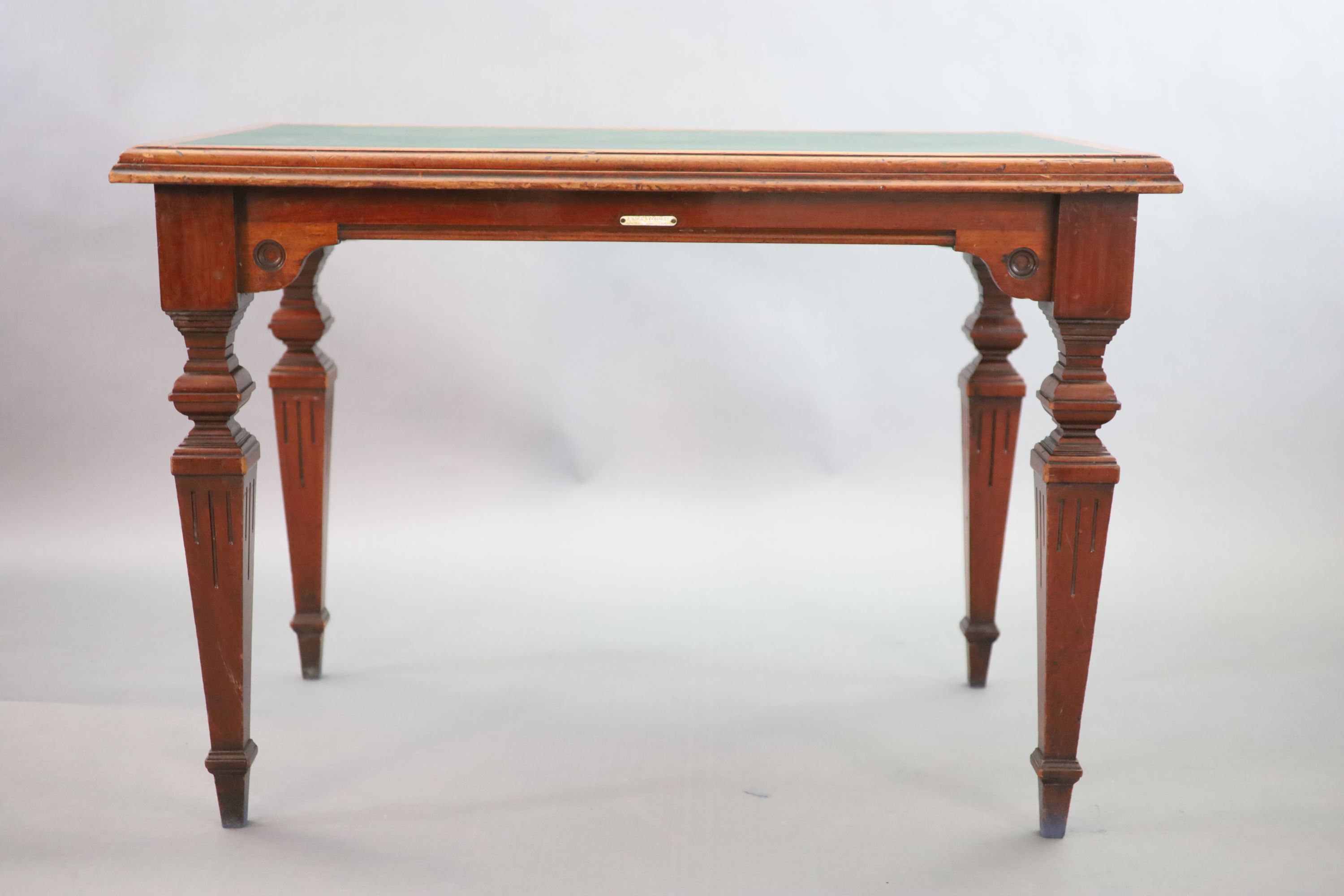 A Victorian mahogany library table, supplied by Sage & Co. Shopfitters of London, W.113cm D.69cm H.78cm